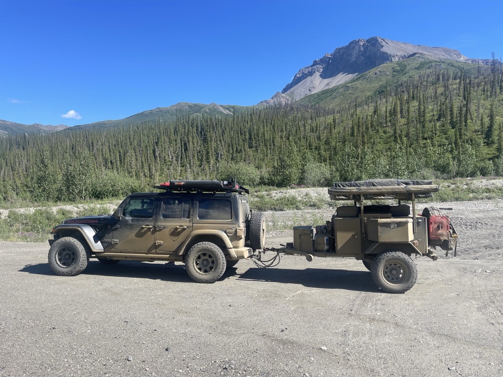 The owner-built Smittybilt off-road trailer with rooftop tent and awning deployed